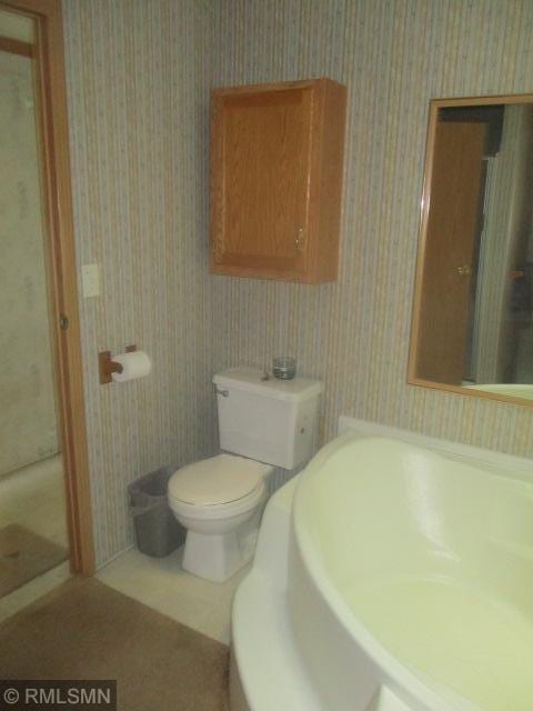 32546 360th St, Kimberly Twp, MN 56431 - full bathroom with wallpapered walls and toilet