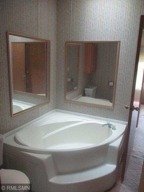 32546 360th St, Kimberly Twp, MN 56431 - bathroom featuring wallpapered walls and toilet