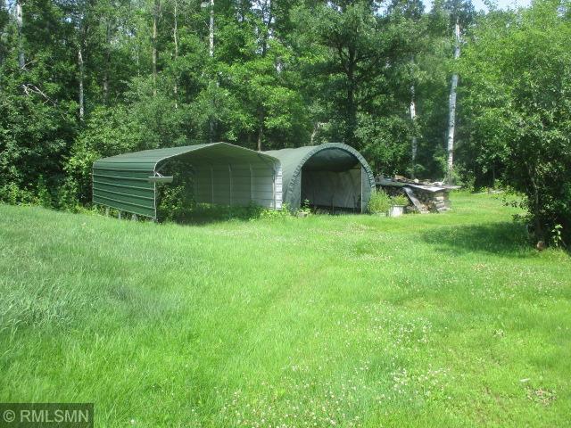 32546 360th St, Kimberly Twp, MN 56431 - view of yard featuring a carport and a forest view