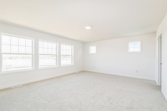 6743 Tamarack Ln, Corcoran, MN 55340 - spare room featuring light carpet and baseboards