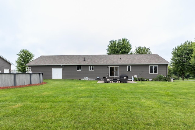 1902 11th Ave NE, Kasson, MN 55944 - back of house featuring a yard and a patio