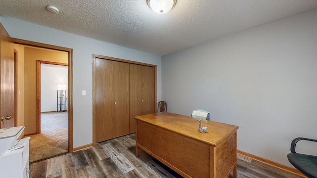 1902 11th Ave NE, Kasson, MN 55944 - office area with wood finished floors and a textured ceiling