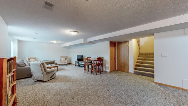 1902 11th Ave NE, Kasson, MN 55944 - carpeted living area featuring stairs and a textured ceiling