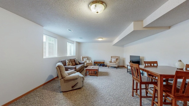 1902 11th Ave NE, Kasson, MN 55944 - carpeted living room with a textured ceiling and baseboards