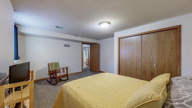 1902 11th Ave NE, Kasson, MN 55944 - carpeted bedroom with a closet and a textured ceiling