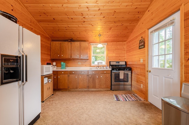 4236 Smith Lake Rd SE, Osakis, MN 56360 - kitchen featuring vaulted ceiling, white appliances, brown cabinetry, light colored carpet, and light countertops