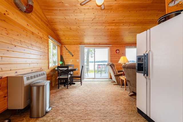4236 Smith Lake Rd SE, Osakis, MN 56360 - office area featuring light colored carpet, wooden ceiling, wooden walls, vaulted ceiling, and ceiling fan