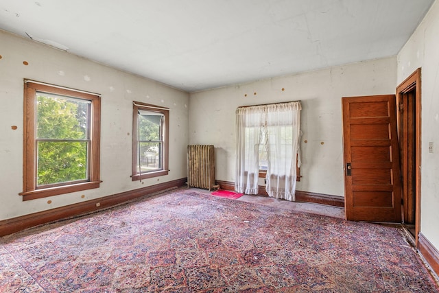 2416 13th Ave S, Minneapolis, MN 55404 - unfurnished room with baseboards and radiator