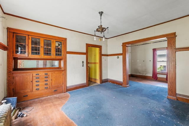 2416 13th Ave S, Minneapolis, MN 55404 - unfurnished dining area with ornamental molding and carpet flooring