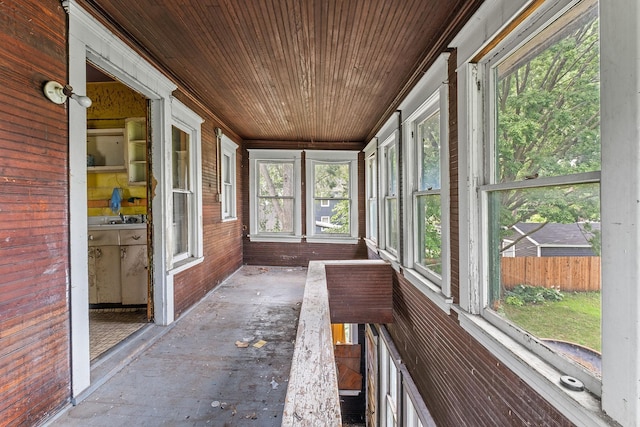 2416 13th Ave S, Minneapolis, MN 55404 - unfurnished sunroom featuring wooden ceiling and wooden walls