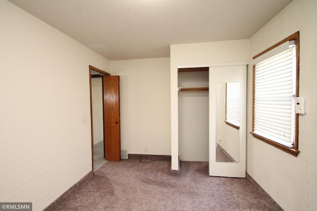 5327 53rd Ave N, Crystal, MN 55429 - unfurnished bedroom featuring carpet floors, a closet, and a textured ceiling