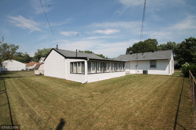 5327 53rd Ave N, Crystal, MN 55429 - back of house with roof with shingles and a sunroom