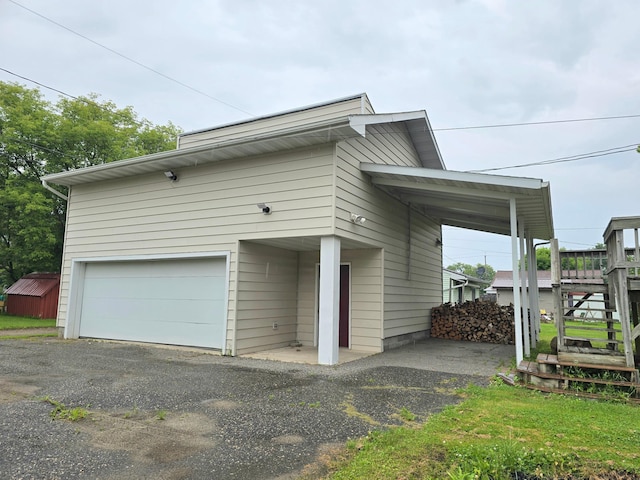 1218 2nd Ave E, International Falls, MN 56649 - view of side of property featuring a garage and driveway