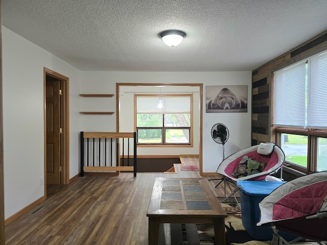1218 2nd Ave E, International Falls, MN 56649 - laundry room featuring wood finished floors and a textured ceiling