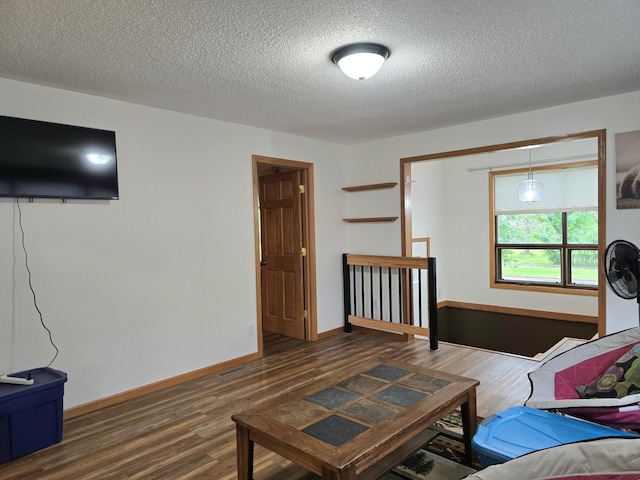 1218 2nd Ave E, International Falls, MN 56649 - bedroom featuring wood finished floors and a textured ceiling