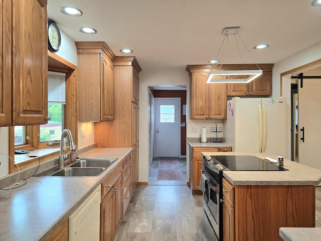 1218 2nd Ave E, International Falls, MN 56649 - kitchen with white appliances, light countertops, a center island, recessed lighting, and brown cabinets