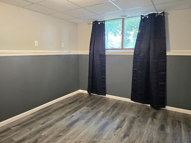 1218 2nd Ave E, International Falls, MN 56649 - empty room featuring a drop ceiling and wood finished floors