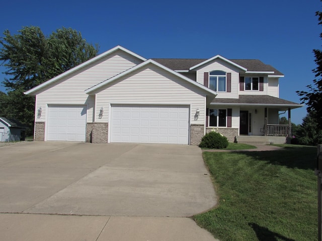1575 Cornerstone Ln, Owatonna, MN 55060 - view of front facade featuring brick siding, an attached garage, concrete driveway, and a porch