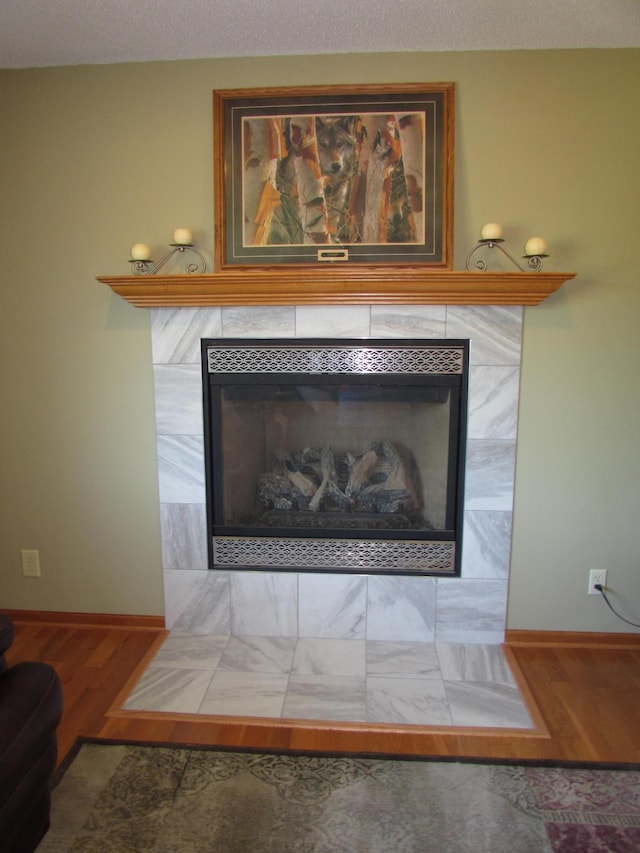 1575 Cornerstone Ln, Owatonna, MN 55060 - detailed view of a tiled fireplace and wood finished floors