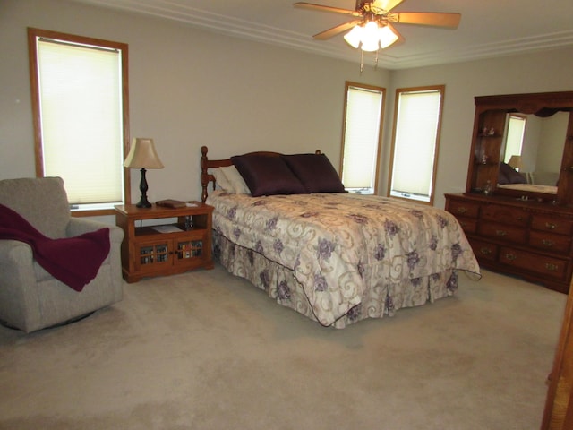 1575 Cornerstone Ln, Owatonna, MN 55060 - carpeted bedroom with crown molding and a ceiling fan