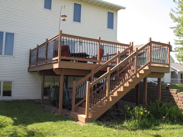 1575 Cornerstone Ln, Owatonna, MN 55060 - back of property featuring stairs, a wooden deck, and a yard