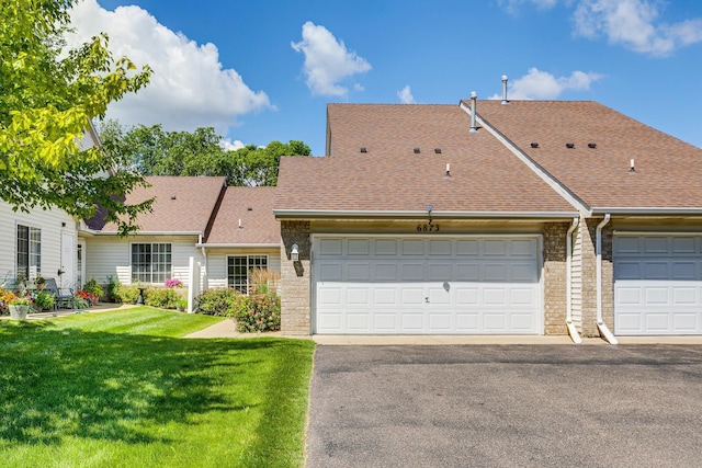 6873 Benton Way Unit 59, Inver Grove Heights, MN 55076 - view of front of house featuring a shingled roof, a front lawn, brick siding, and asphalt driveway