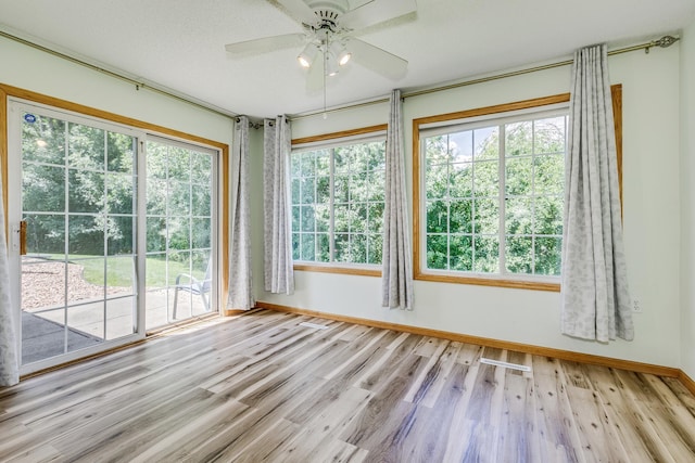 6873 Benton Way Unit 59, Inver Grove Heights, MN 55076 - empty room with healthy amount of natural light, wood finished floors, and ceiling fan