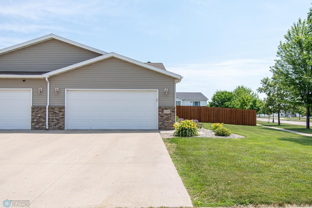 3590 Fillmore St S, Fargo, ND 58104 - view of front facade featuring brick siding, driveway, and an attached garage