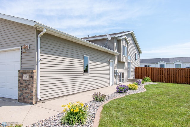 3590 Fillmore St S, Fargo, ND 58104 - view of side of property with a garage