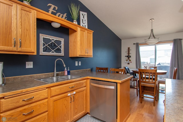3590 Fillmore St S, Fargo, ND 58104 - kitchen with lofted ceiling, stainless steel dishwasher, light wood-type flooring, a peninsula, and decorative light fixtures