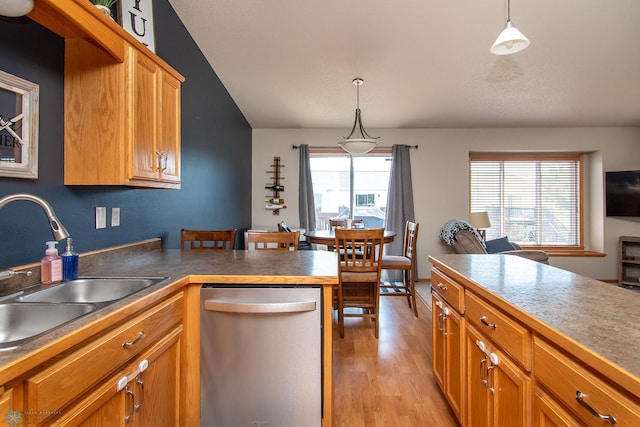 3590 Fillmore St S, Fargo, ND 58104 - kitchen featuring stainless steel dishwasher, light wood-type flooring, hanging light fixtures, a peninsula, and lofted ceiling