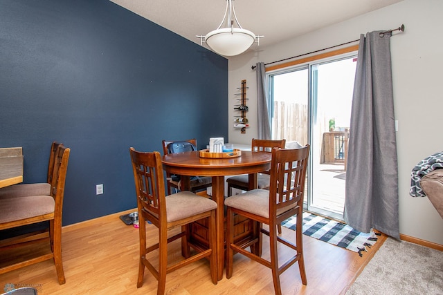 3590 Fillmore St S, Fargo, ND 58104 - dining area with light wood finished floors and baseboards