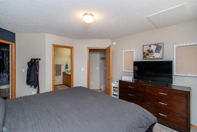 3590 Fillmore St S, Fargo, ND 58104 - bedroom with a textured ceiling and ensuite bath