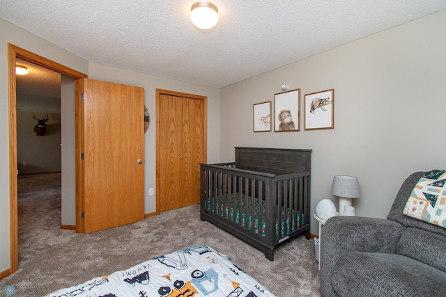 3590 Fillmore St S, Fargo, ND 58104 - bedroom with carpet flooring, a closet, and a textured ceiling
