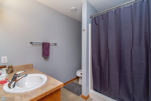 3590 Fillmore St S, Fargo, ND 58104 - full bathroom with a textured ceiling, curtained shower, vanity, and tile patterned floors