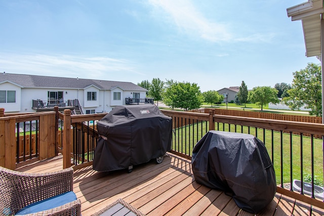 3590 Fillmore St S, Fargo, ND 58104 - deck with a grill, a lawn, and a residential view