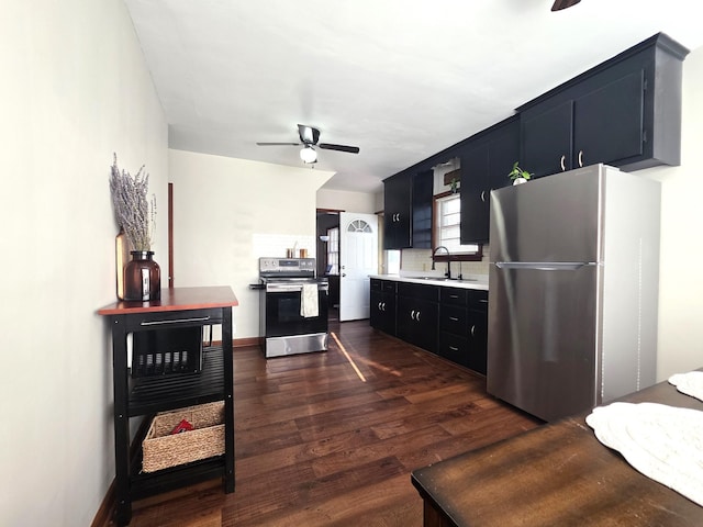 3709 Quail Ave N, Robbinsdale, MN 55422 - kitchen with appliances with stainless steel finishes, a ceiling fan, dark wood-style floors, light countertops, and dark cabinets