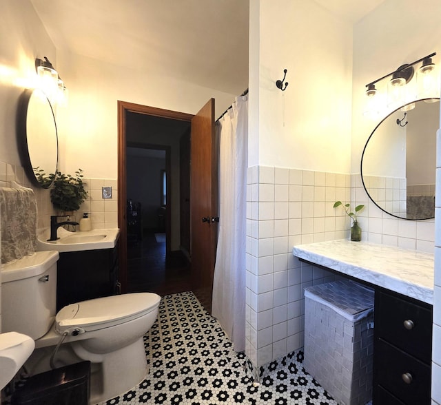 3709 Quail Ave N, Robbinsdale, MN 55422 - bathroom with tile walls, vanity, a shower with curtain, and a wainscoted wall