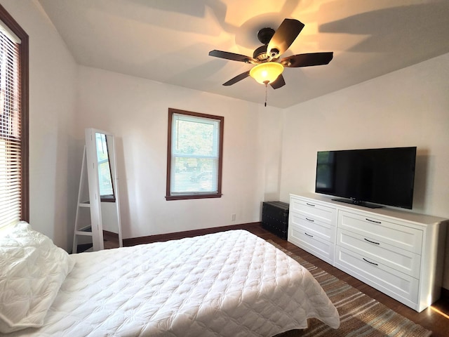 3709 Quail Ave N, Robbinsdale, MN 55422 - bedroom with multiple windows, dark wood finished floors, and a ceiling fan