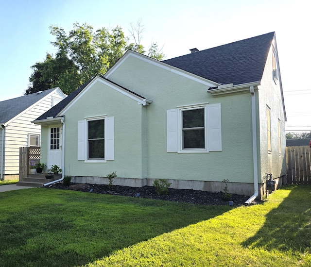 3709 Quail Ave N, Robbinsdale, MN 55422 - view of property exterior featuring roof with shingles and stucco siding