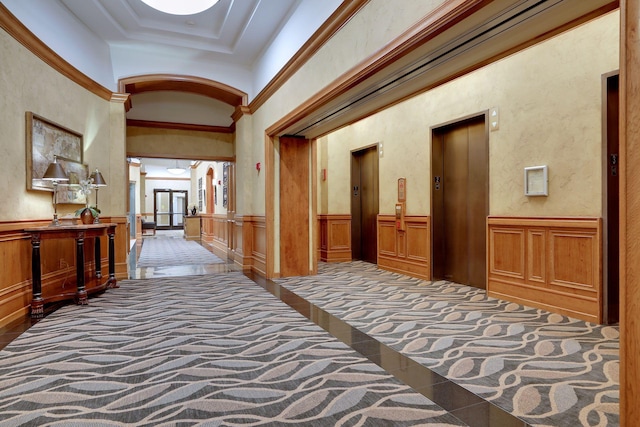 500 Grant St Unit 1105, Minneapolis, MN 55404 - hall featuring tile patterned floors, elevator, a wainscoted wall, ornamental molding, and arched walkways