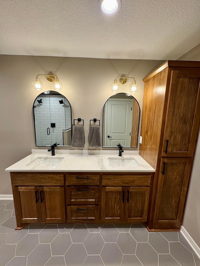 23900 Taurus St, Linwood Twp, MN 55079 - full bath with double vanity, tile patterned floors, and a textured ceiling