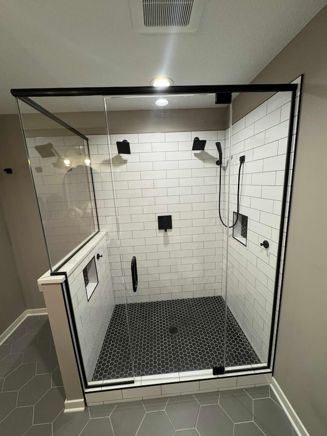 23900 Taurus St, Linwood Twp, MN 55079 - bathroom with tile patterned flooring and a stall shower