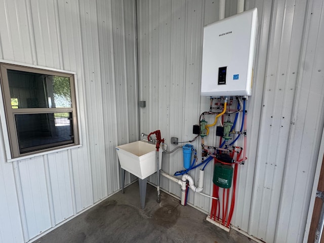 90760 US Highway 71, Christiania Twp, MN 56101 - utility room featuring water heater and a sink