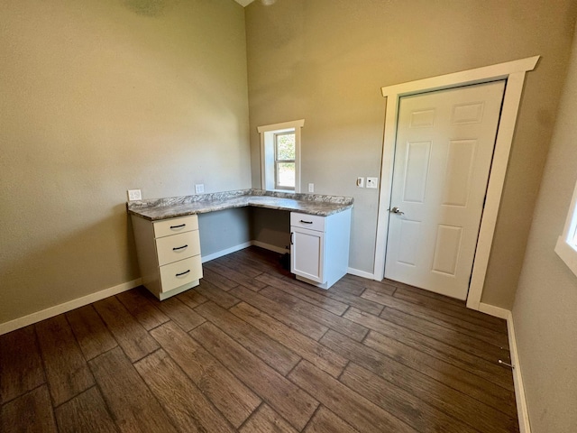 90760 US Highway 71, Christiania Twp, MN 56101 - unfurnished office with built in desk and dark wood-style floors