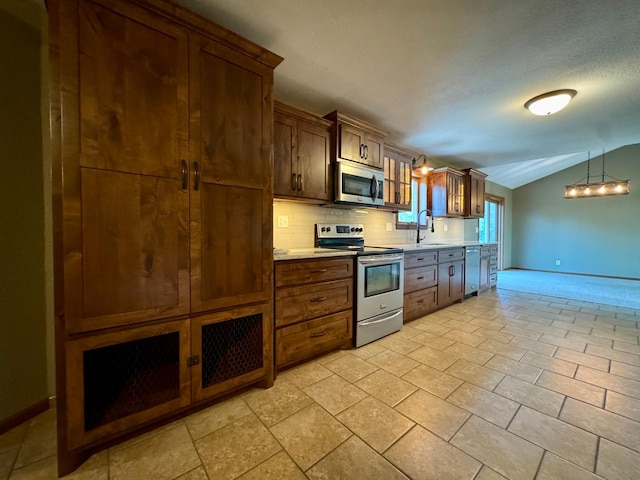 90760 US Highway 71, Christiania Twp, MN 56101 - kitchen featuring appliances with stainless steel finishes, vaulted ceiling, backsplash, light countertops, and a chandelier