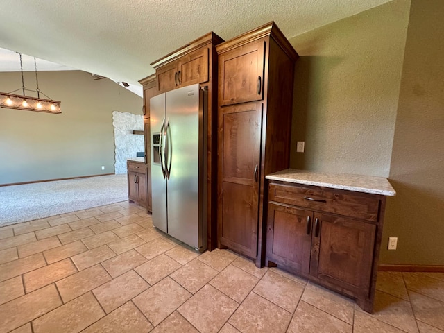 90760 US Highway 71, Christiania Twp, MN 56101 - kitchen featuring stainless steel refrigerator with ice dispenser, lofted ceiling, a textured ceiling, pendant lighting, and light carpet