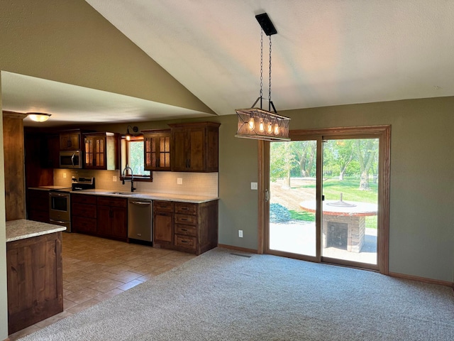 90760 US Highway 71, Christiania Twp, MN 56101 - kitchen featuring stainless steel appliances, light countertops, glass insert cabinets, healthy amount of natural light, and vaulted ceiling