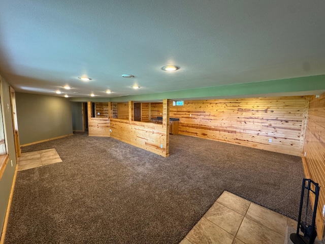 90760 US Highway 71, Christiania Twp, MN 56101 - unfurnished living room featuring wood walls, carpet, and recessed lighting