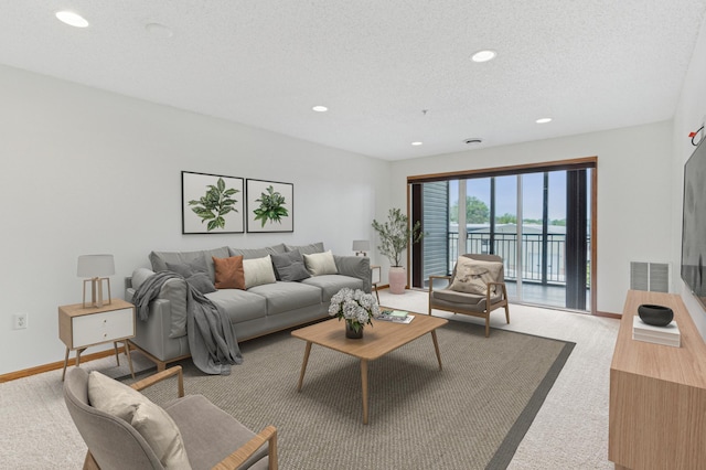 2231 Penn Pl Unit 224, North Saint Paul, MN 55109 - living area with recessed lighting, carpet, and a textured ceiling